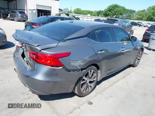 2016 Nissan Maxima SR with VIN 1N4AA6AP9GC414943, listed as a IAAI auction lot 41976295 with 154,738 mi miles and . Bid and sale history available at DreamBid. Image 4.