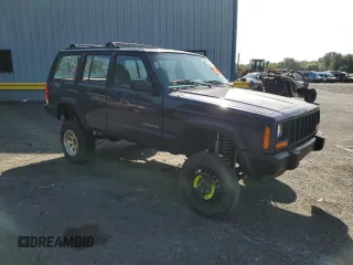1999 Jeep Cherokee SE with VIN 1J4FF28S0XL541871, listed as a Copart auction lot 59250264 with Not provided miles and Salvage title. Bid and sale history available at DreamBid. Image 4.