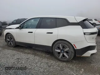 2023 BMW iX xDrive50 with VIN WB523CF04PCL67044, listed as a Copart auction lot 82805014 with 12,858 mi miles and Salvage Title. Bid and sale history available at carsss.com. Image 2.