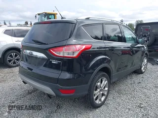 2014 Ford Escape Titanium with VIN 1FMCU9J95EUD60587, listed as a IAAI auction lot 42129854 with 155,559 mi miles and . Bid and sale history available at DreamBid. Image 4.