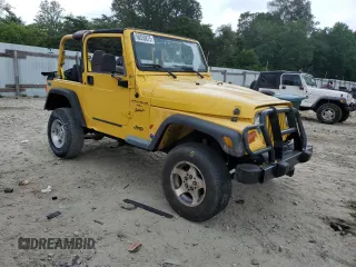 2000 Jeep Wrangler Sport with VIN 1J4FA49SXYP789791, listed as a Copart auction lot 60538875 with Not provided miles and Salvage title. Bid and sale history available at DreamBid. Image 4.