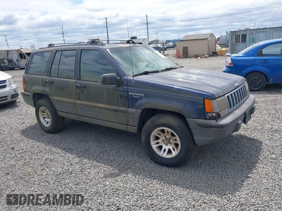 1994 Jeep Grand Cherokee Laredo z VIN 1J4GZ58Y2RC320793, wystawiony jako IAAI lot #42781115 z przebiegiem 275 518 mil mil oraz . Historia ofert i sprzedaży dostępna na DreamBid. Obrazek 1.