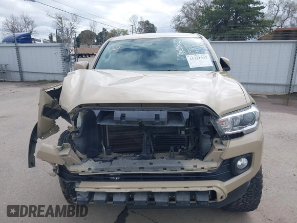 2016 Toyota Tacoma SR5 with VIN 3TMDZ5BN3GM003351, listed as a IAAI auction lot 41721932 with 100,774 mi miles and . Bid and sale history available at DreamBid. Image 13.