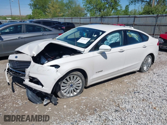 2013 Ford Fusion SE Hybrid z VIN 3FA6P0LU9DR349321, wystawiony jako IAAI lot #42156321 z przebiegiem 90 688 mil mil oraz . Historia ofert i sprzedaży dostępna na DreamBid. Obrazek 2.