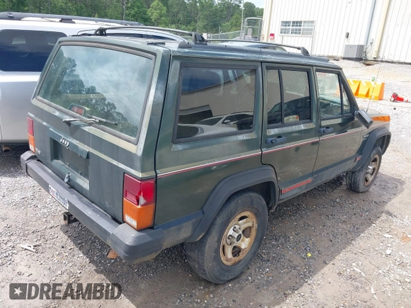 1996 Jeep Cherokee Sport with VIN 1J4FT68S6TL269966, listed as a IAAI auction lot 42211628 with 212,944 mi miles and . Bid and sale history available at DreamBid. Image 4.