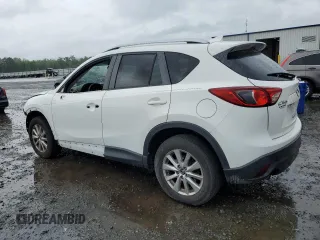 2016 Mazda CX-5 Touring z VIN JM3KE2CY5G0849288, wystawiony jako Copart lot #54594545 z przebiegiem 90 882 mil mil oraz Szkoda całkowita • Salvage title. Historia ofert i sprzedaży dostępna na DreamBid. Obrazek 2.