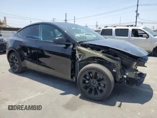 2024 Tesla Model Y Long Range with VIN 7SAYGDEEXRA253111, listed as a Copart auction lot 60929295 with 16,423 mi miles and Salvage title. Bid and sale history available at DreamBid. Image 4.