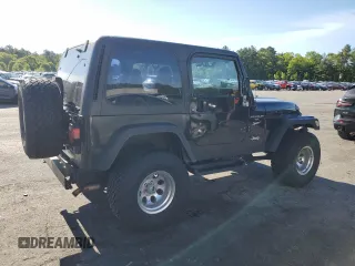 2001 Jeep Wrangler Sport with VIN 1J4FA49S21P339042, listed as a Copart auction lot 56922555 with 113,315 mi miles and Salvage title. Bid and sale history available at DreamBid. Image 3.