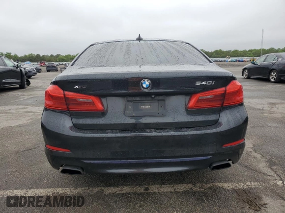 2019 BMW 5 Series 540i xDrive with VIN WBAJE7C54KWW19994, listed as a Copart auction lot 57973055 with 121,995 mi miles and Salvage title. Bid and sale history available at DreamBid. Image 6.