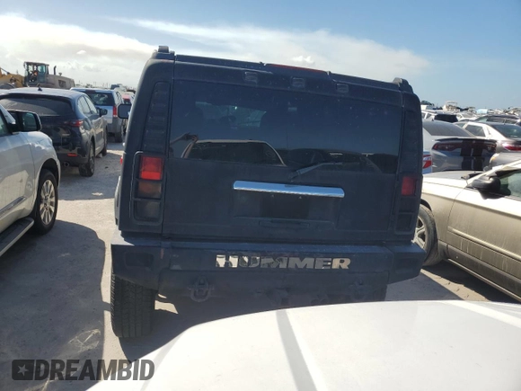 2003 Hummer H2 with VIN 5GRGN23U13H143781, listed as a Copart auction lot 77833264 with 0 mi miles and Salvage Title. Bid and sale history available at carsss.com. Image 6.