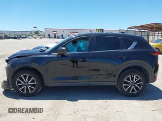 2018 Mazda CX-5 Touring z VIN JM3KFACM3J1339074, wystawiony jako IAAI lot #42317039 z przebiegiem 82 799 mil mil oraz . Historia ofert i sprzedaży dostępna na DreamBid. Obrazek 15.