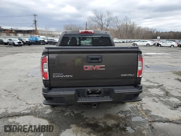 2020 GMC Canyon 4WD Denali with VIN 1GTG6EEN1L1134173, listed as a Copart auction lot 80079364 with 74,708 mi miles and Salvage Title. Bid and sale history available at carsss.com. Image 6.