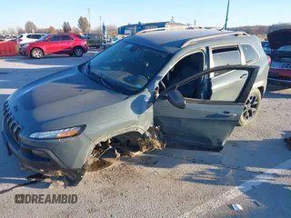 2015 Jeep Cherokee Trailhawk with VIN 1C4PJMBSXFW614416, listed as a IAAI auction lot 41033241 with 112,015 mi miles. Bid and sale history available at carsss.com. Image 18.