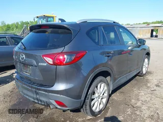2014 Mazda CX-5 Grand Touring with VIN JM3KE4DY2E0312952, listed as a IAAI auction lot 42138721 with 99,993 mi miles and . Bid and sale history available at DreamBid. Image 4.