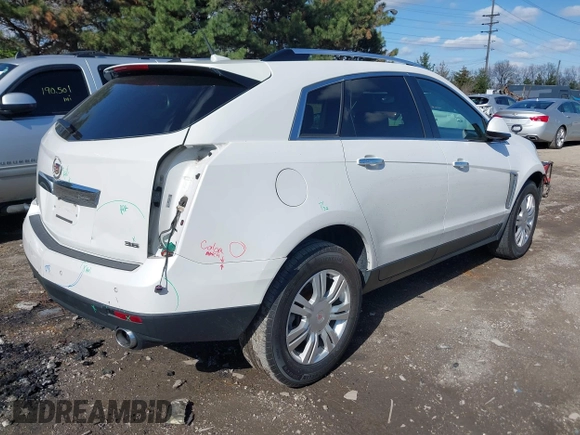 2014 Cadillac SRX Luxury Collection with VIN 3GYFNBE35ES581743, listed as a IAAI auction lot 41995293 with 140,987 mi miles. Bid and sale history available at carsss.com. Image 4.