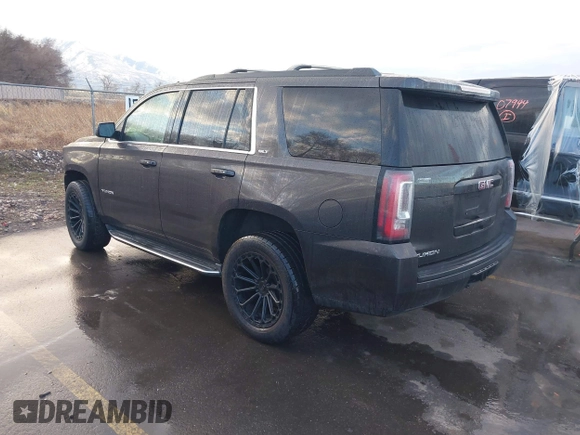 2015 GMC Yukon SLT with VIN 1GKS2BKC7FR110106, listed as a IAAI auction lot 41702260 with 108,679 mi miles. Bid and sale history available at carsss.com. Image 3.