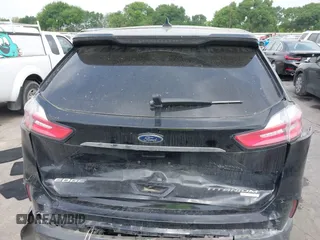 2020 Ford Edge Titanium z VIN 2FMPK3K92LBB24713, wystawiony jako IAAI lot #41949412 z przebiegiem 97 014 mil mil oraz . Historia ofert i sprzedaży dostępna na DreamBid. Obrazek 16.