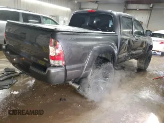 2014 Toyota Tacoma with VIN 5TFLU4ENXEX089927, listed as a Copart auction lot 52140565 with 112,924 mi miles and Salvage Title. Bid and sale history available at DreamBid. Image 3.