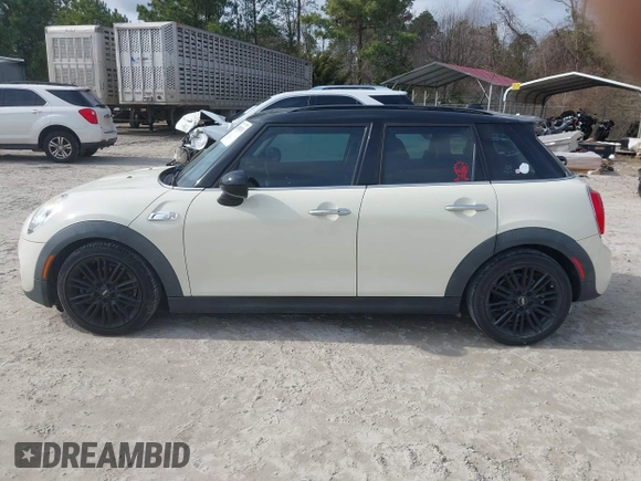 2017 MINI Hardtop 4 Door Cooper S z VIN WMWXU3C54H2D32602, wystawiony jako IAAI lot #41458333 z przebiegiem 124 235 mil mil oraz . Historia ofert i sprzedaży dostępna na DreamBid. Obrazek 14.