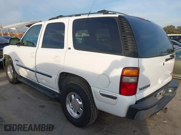 2001 GMC Yukon SLT with VIN 1GKEK13T41R171024, listed as a IAAI auction lot 41582633 with 216,077 mi miles. Bid and sale history available at carsss.com. Image 3.