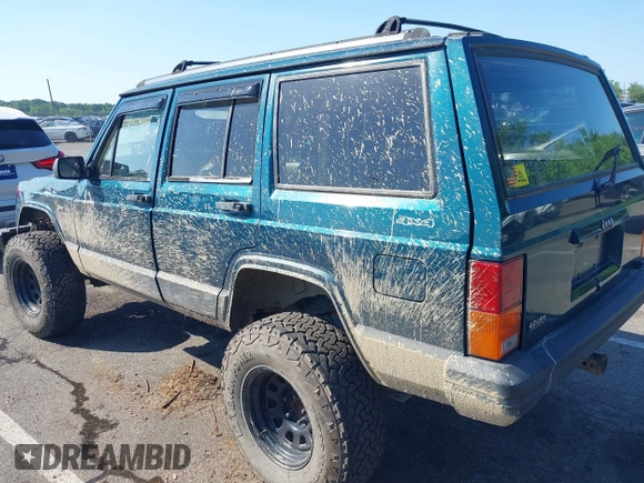 1995 Jeep Cherokee Sport z VIN 1J4FJ68S7SL623451, wystawiony jako IAAI lot #42581407 z przebiegiem 160 581 mil mil oraz . Historia ofert i sprzedaży dostępna na DreamBid. Obrazek 3.
