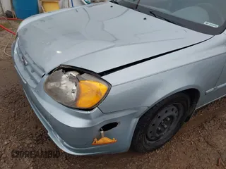 2003 Hyundai Accent GL with VIN KMHCG45C43U465523, listed as a IAAI auction lot 40883056 with 95,770 mi miles. Bid and sale history available at carsss.com. Image 6.