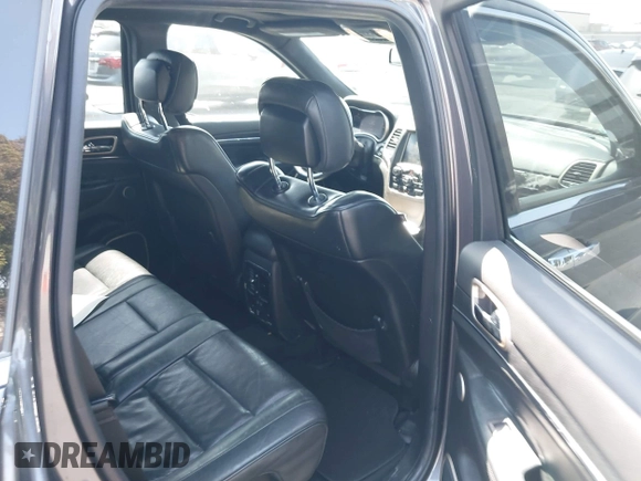 2014 Jeep Grand Cherokee Summit with VIN 1C4RJFJG8EC434899, listed as a IAAI auction lot 42399912 with 186,840 mi miles and . Bid and sale history available at DreamBid. Image 8.