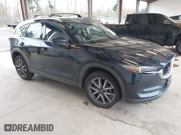 2018 Mazda CX-5 Grand Touring with VIN JM3KFBDM4J0302870, listed as a IAAI auction lot 41934217 with 57,151 mi miles. Bid and sale history available at carsss.com. Image 1.