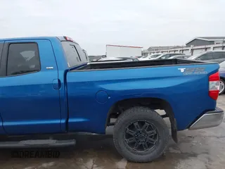 2016 Toyota Tundra SR z VIN 5TFRM5F13GX095535, wystawiony jako IAAI lot #41618316 z przebiegiem 131 386 mil mil oraz . Historia ofert i sprzedaży dostępna na DreamBid. Obrazek 19.