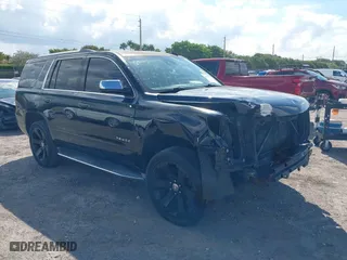 2015 Chevrolet Tahoe LTZ with VIN 1GNSCCKC7FR746028, listed as a IAAI auction lot 41674775 with 198,067 mi miles. Bid and sale history available at carsss.com. Image 1.