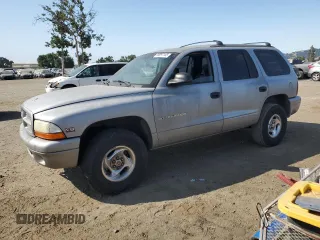 1999 Dodge Durango with VIN 1B4HS28Y8XF574563, listed as a Copart auction lot 59997105 with 236,037 mi miles and Salvage title. Bid and sale history available at DreamBid. Image 1.