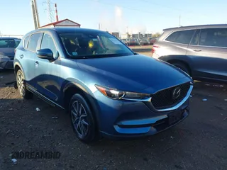 2018 Mazda CX-5 Touring z VIN JM3KFBCM8J0465006, wystawiony jako IAAI lot #40782297 z przebiegiem 59 515 mil mil oraz . Historia ofert i sprzedaży dostępna na DreamBid. Obrazek 1.