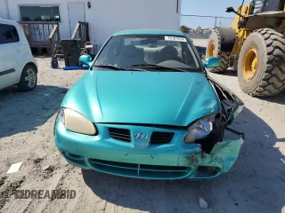 2000 Hyundai Elantra GLS z VIN KMHJF35FXYU998689, wystawiony jako Copart lot #76181814 z przebiegiem 154 743 mil mil oraz Szkoda całkowita • Salvage title. Historia ofert i sprzedaży dostępna na DreamBid. Obrazek 5.