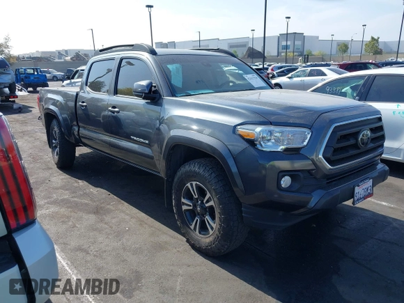 2022 Toyota Tacoma SR5 z VIN 3TMBZ5DN5NM036322, wystawiony jako IAAI lot #42437939 z przebiegiem 77 805 mil mil oraz . Historia ofert i sprzedaży dostępna na DreamBid. Obrazek 1.