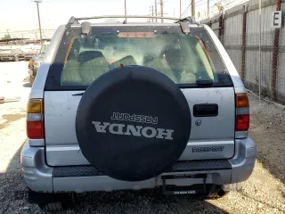 2001 Honda Passport LX z VIN 4S6CK58WX14410363, wystawiony jako Copart lot #77500294 z przebiegiem 195 272 mil mil oraz Czysty tytuł • Clean title. Historia ofert i sprzedaży dostępna na DreamBid. Obrazek 6.
