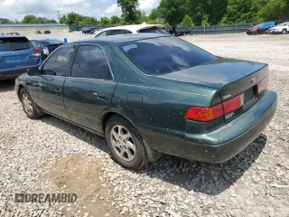 2000 Toyota Camry CE z VIN 4T1BG22K0YU708702, wystawiony jako Copart lot #56755285 z przebiegiem 318 734 mil mil oraz Szkoda całkowita • Salvage title. Historia ofert i sprzedaży dostępna na DreamBid. Obrazek 2.