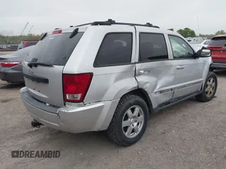 2009 Jeep Grand Cherokee Laredo with VIN 1J8GR48K09C557139, listed as a IAAI auction lot 41994604 with 1 mi miles. Bid and sale history available at carsss.com. Image 4.