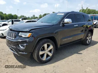 2015 Jeep Grand Cherokee Overland with VIN 1C4RJFCG4FC104420, listed as a Copart auction lot 66014955 with 165,645 mi miles and Salvage title. Bid and sale history available at DreamBid. Image 1.
