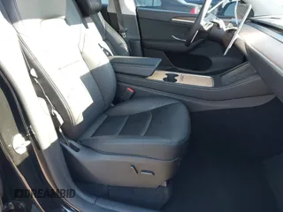 2024 Tesla Model Y Long Range with VIN 7SAYGDEEXRF983040, listed as a IAAI auction lot 41555332 with 79,506 mi miles and . Bid and sale history available at DreamBid. Image 5.