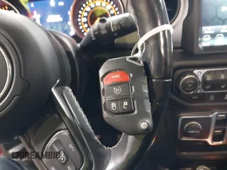 2021 Jeep Wrangler Unlimited Sport S with VIN 1C4HJXDN1MW596334, listed as a IAAI auction lot 41730278 with 64,126 mi miles and . Bid and sale history available at DreamBid. Image 11.