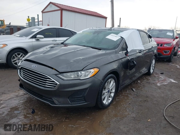 2020 Ford Fusion SE z VIN 3FA6P0LU6LR185721, wystawiony jako IAAI lot #41639827 z przebiegiem 63 857 mil mil oraz . Historia ofert i sprzedaży dostępna na DreamBid. Obrazek 2.