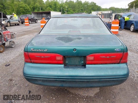 1996 Ford Thunderbird LX z VIN 1FALP62W9TH118637, wystawiony jako IAAI lot #42311641 z przebiegiem 96 361 mil mil oraz . Historia ofert i sprzedaży dostępna na DreamBid. Obrazek 16.