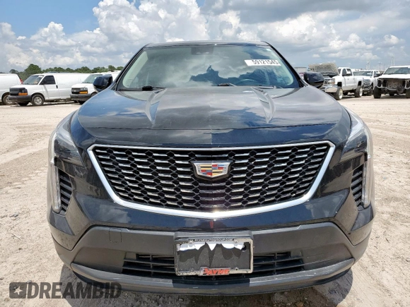 2023 Cadillac XT4 FWD Luxury with VIN 1GYAZAR46PF178003, listed as a Copart auction lot 59121545 with 42,000 mi miles and Salvage title. Bid and sale history available at DreamBid. Image 5.