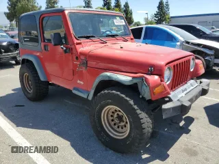 1999 Jeep Wrangler Sport with VIN 1J4FY19S7XP401120, listed as a Copart auction lot 64233665 with 129,708 mi miles and Salvage title. Bid and sale history available at DreamBid. Image 4.