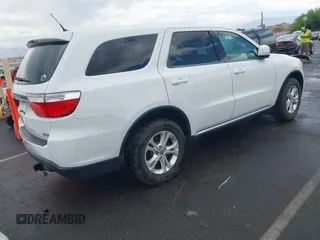2013 Dodge Durango SXT with VIN 1C4RDJAG7DC659050, listed as a IAAI auction lot 42637236 with 162,458 mi miles and . Bid and sale history available at DreamBid. Image 4.