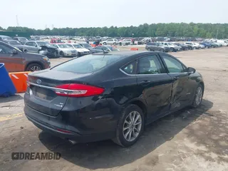 2017 Ford Fusion Hybrid SE with VIN 3FA6P0LU4HR358501, listed as a IAAI auction lot 42287032 with 165,456 mi miles and . Bid and sale history available at DreamBid. Image 4.