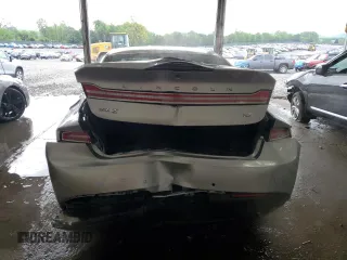 2015 Lincoln MKZ z VIN 3LN6L2GK4FR613117, wystawiony jako Copart lot #54141735 z przebiegiem 129 072 mil mil oraz Szkoda całkowita • Salvage title. Historia ofert i sprzedaży dostępna na DreamBid. Obrazek 6.