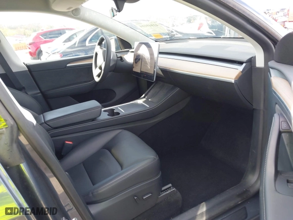 2023 Tesla Model Y Long Range with VIN 7SAYGDEE3PA204992, listed as a IAAI auction lot 41849104 with 22,490 mi miles. Bid and sale history available at carsss.com. Image 5.
