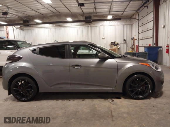 2016 Hyundai Veloster with VIN KMHTC6ADXGU272594, listed as a IAAI auction lot 42437409 with 91,620 mi miles and . Bid and sale history available at DreamBid. Image 13.