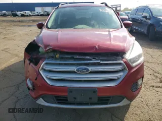 2018 Ford Escape SE z VIN 1FMCU9GD0JUC29279, wystawiony jako Copart lot #54511595 z przebiegiem 77 547 mil mil oraz Czysty tytuł • Clean title. Historia ofert i sprzedaży dostępna na DreamBid. Obrazek 5.